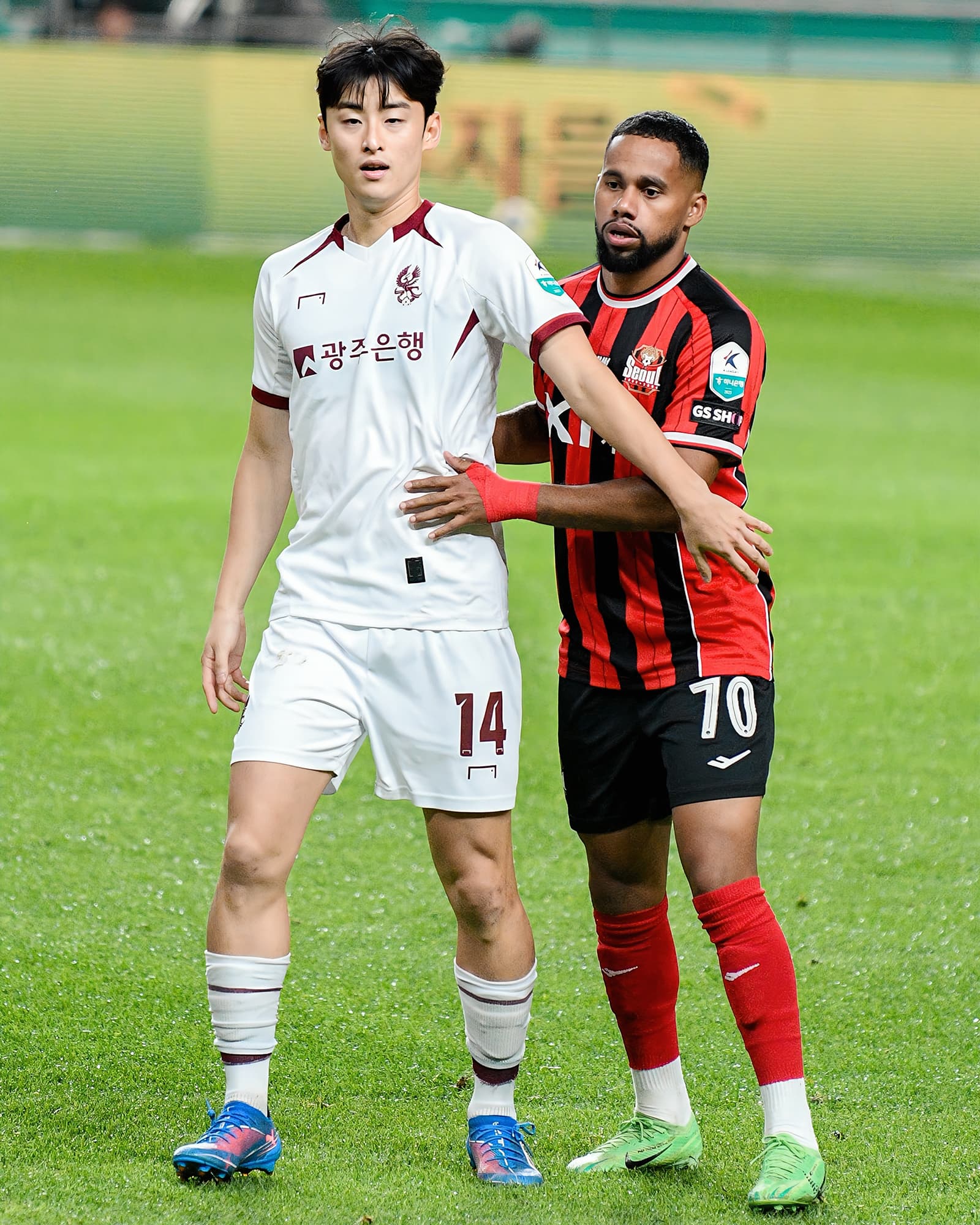 A grassroots coach organising players before a match